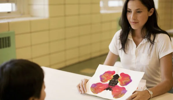 Psychologist holding a paper.