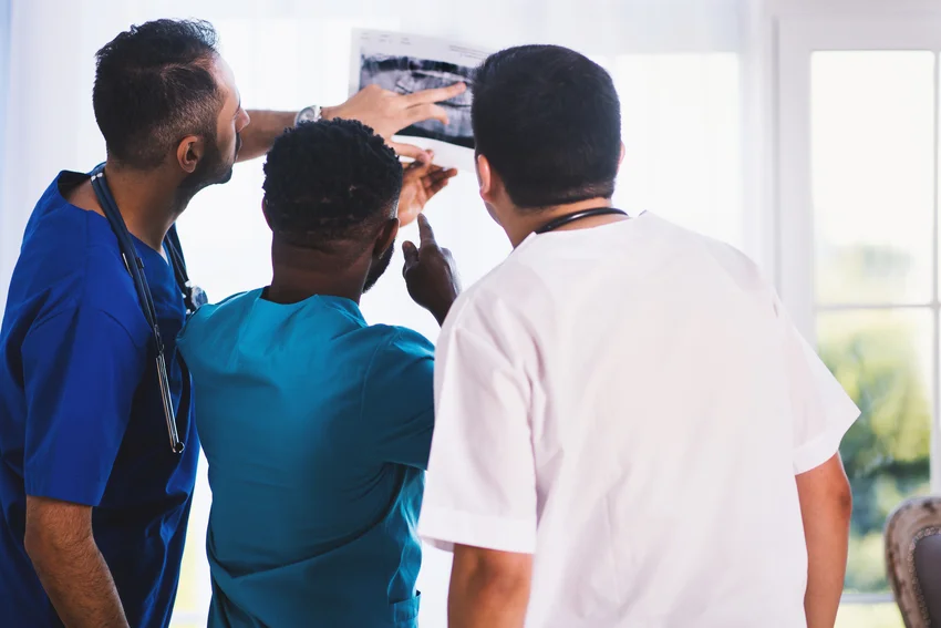 Medical professionals viewing an X-ray.