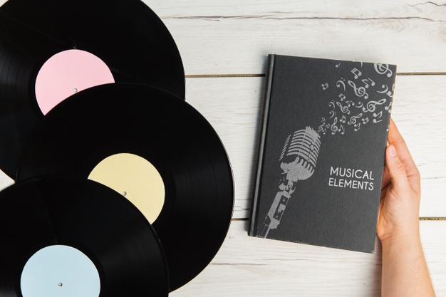 Notebook with Musical elements written on it.