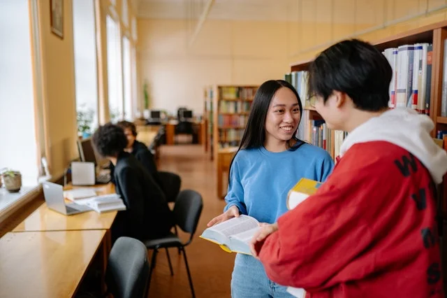 Public university students in campus library.