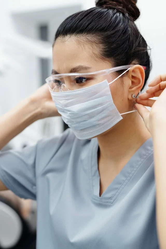 Medical professional in scrubs.