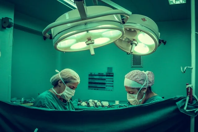 Surgeons in a surgery room.