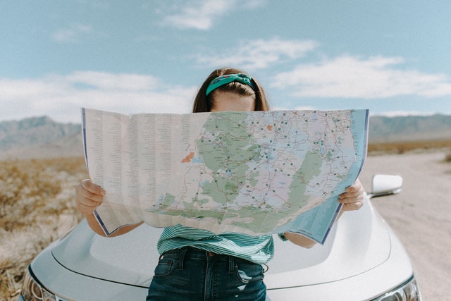 Traveller looking at a map.