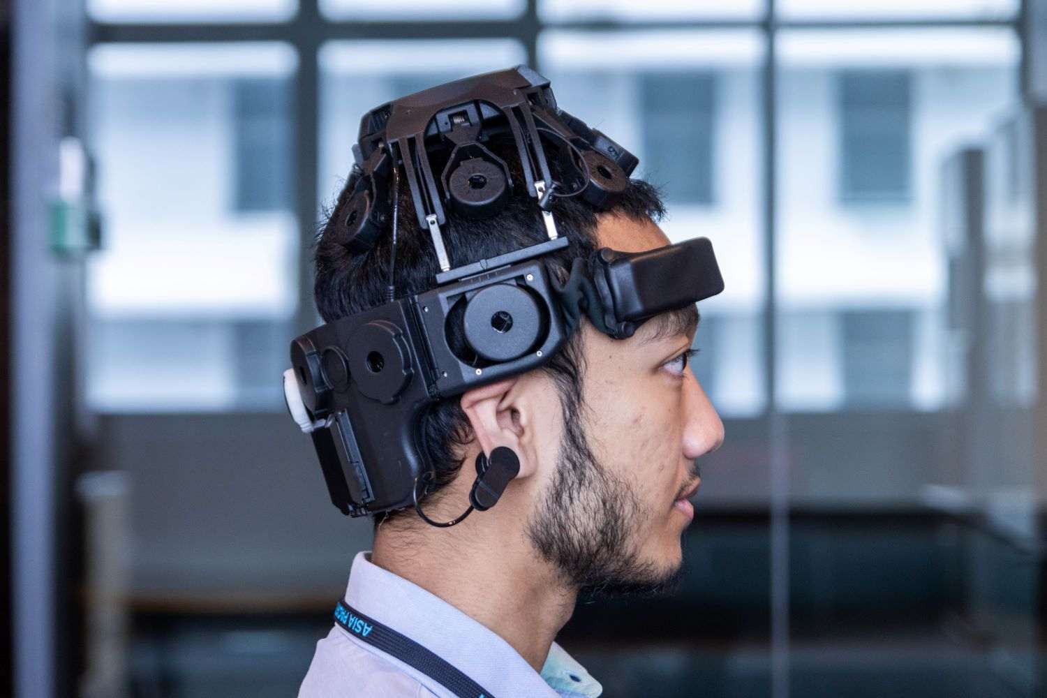 Male psychology student wearing the  Electroencephalogram at APU.