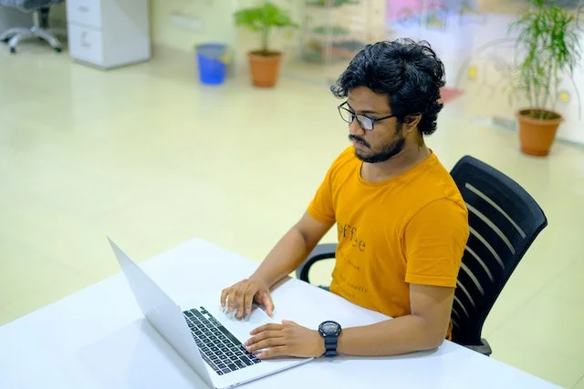 Stressed chemical engineer on his laptop.