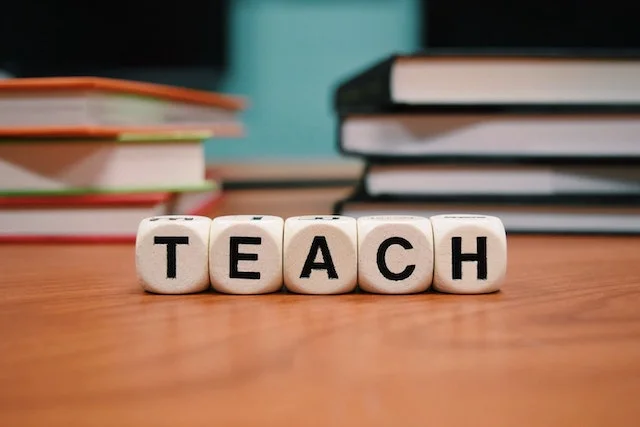 The word teach spelled out in blocks.