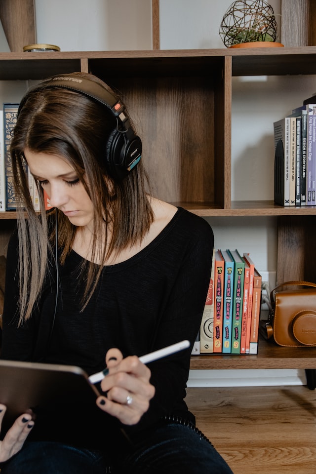 Student listening to music while studying.