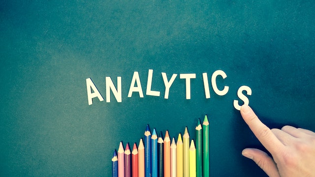 The word analytics on a board.