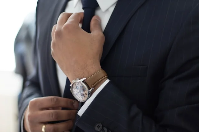 Lawyer fixing his tie.