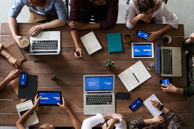 Working adults in a conference room.