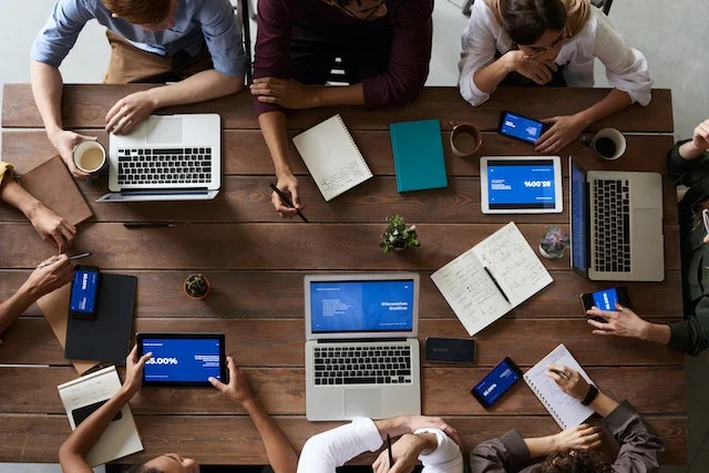 Working adults in a conference room.