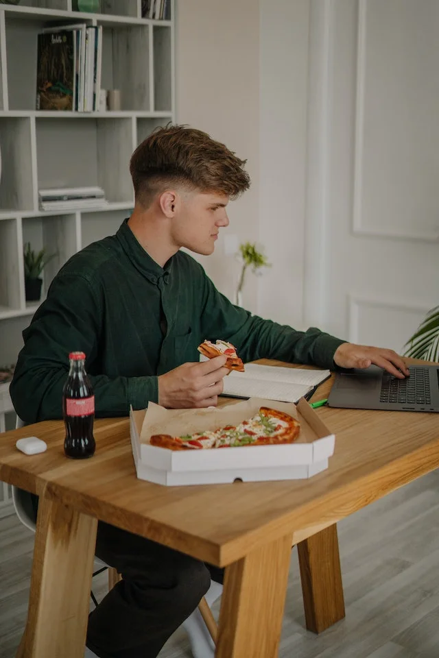 Student having early dinner.